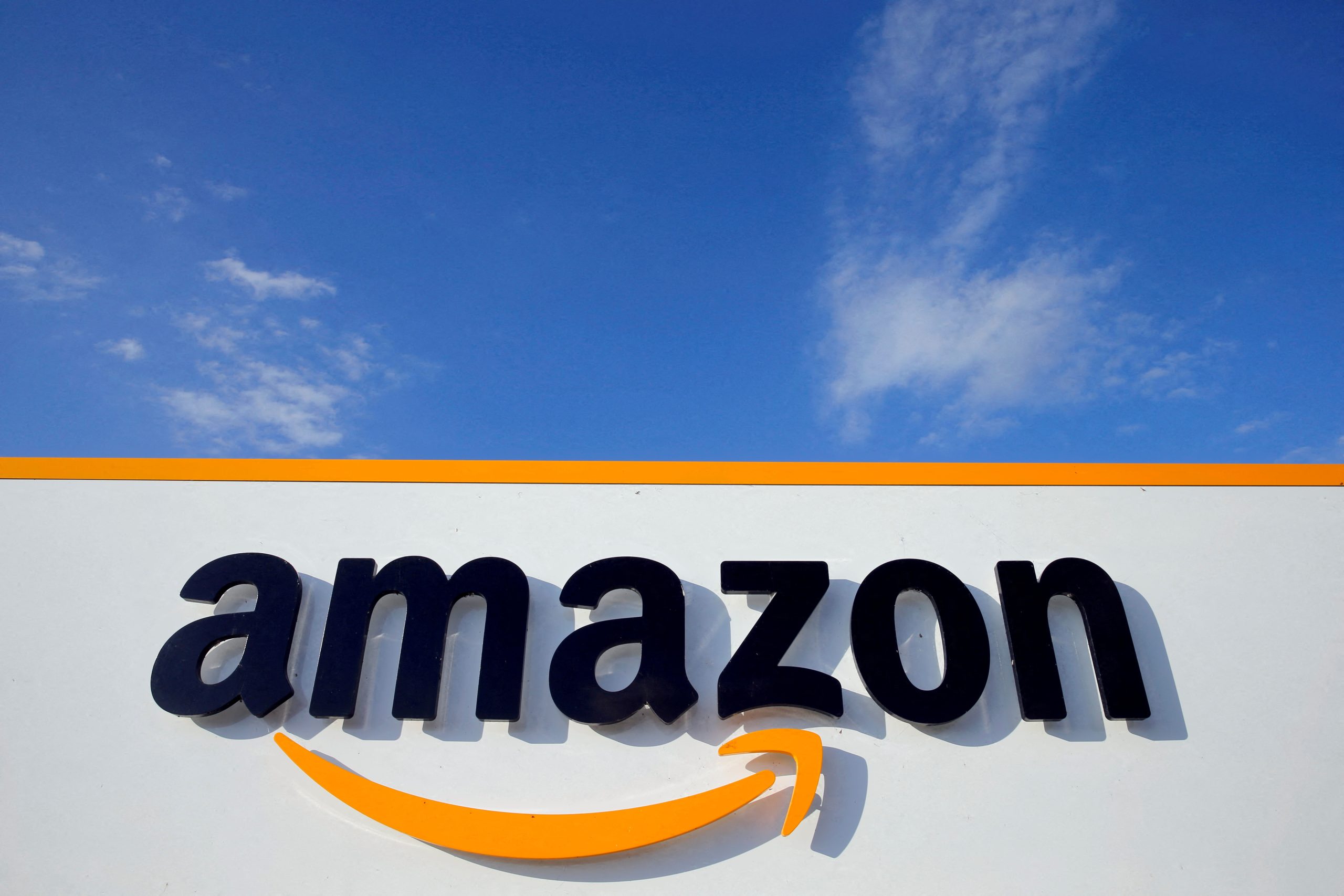 FILE PHOTO: The logo of Amazon is seen at the company logistics center in Boves, France, August 8, 2018.