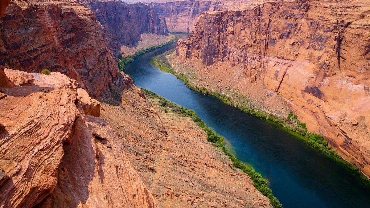 Winding Colorado river through red rock Grand canyon